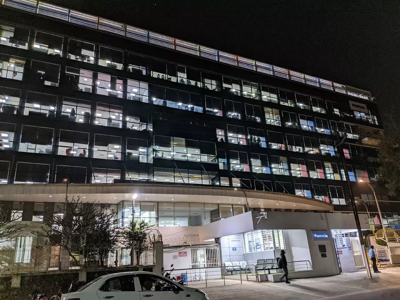 Industrial roofing for Faurecia India, Bhosari: Specialized crimp curve sheet installation at height by Rishonn & Reyansh for automotive manufacturing plants.