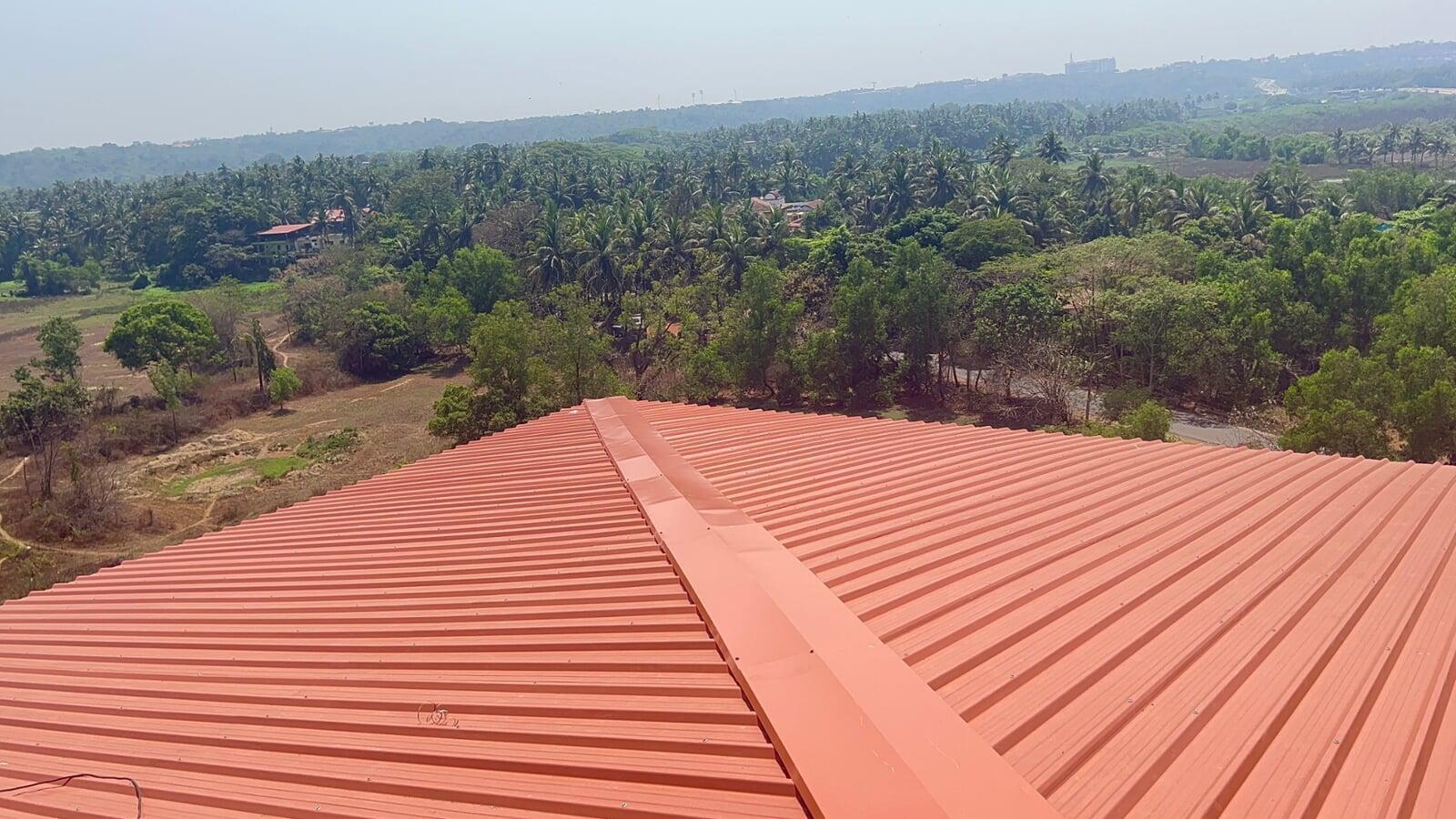Architectural standing seam roofing for Lodha Mumbai: Premium metal building envelope featuring a minimalist aesthetic and hidden fastener technology by Rishonn & Reyansh.