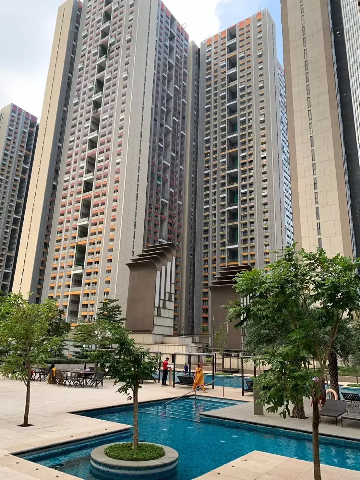 Architectural Kalzip aluminium standing seam canopy at Lodha New Cuffe Parade, Mumbai: Premium curved metal roofing and high-end residential canopy installation by Rishonn & Reyansh for luxury real estate landmarks.
