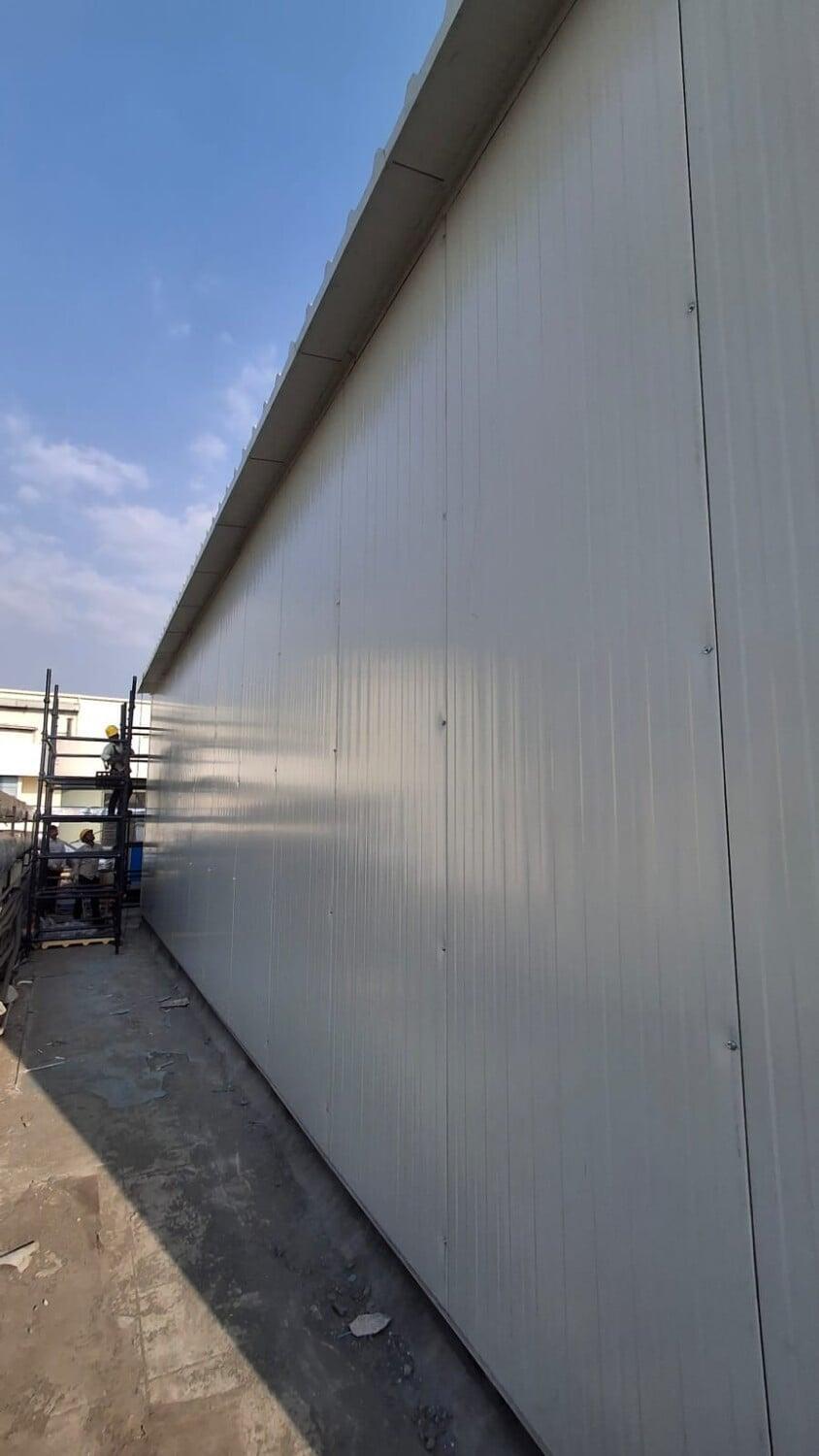 Commercial architectural roofing at Oberoi Mall, Mumbai: Specialized Kliplok roof-on-roof installation by Rishonn & Reyansh for leak-proof retail infrastructure.